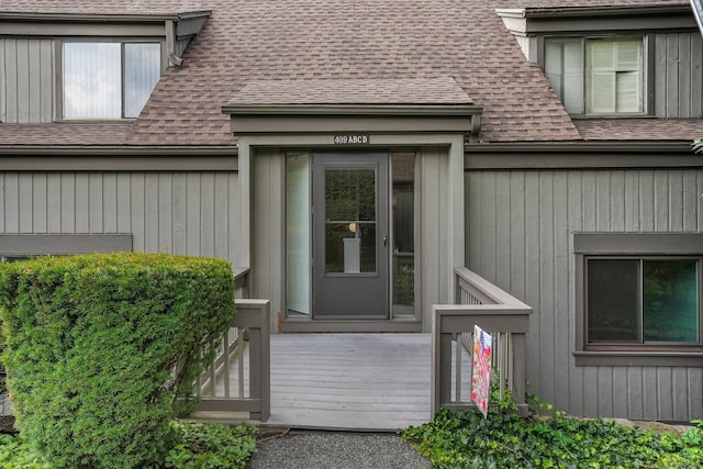499 Heritage Vlg Unit B, Southbury, CT 06488 - property entrance featuring a shingled roof and a wooden deck