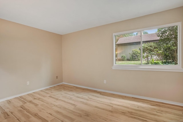 499 Heritage Vlg Unit B, Southbury, CT 06488 - spare room featuring wood finished floors and baseboards