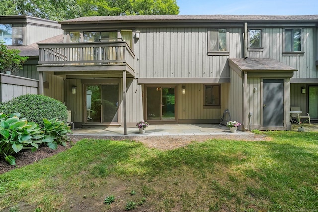 499 Heritage Vlg Unit B, Southbury, CT 06488 - rear view of house with a patio, a yard, a balcony, and roof with shingles