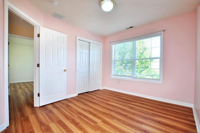 19 Windy Hill Ln Unit 19, Rocky Hill, CT 06067 - unfurnished bedroom with light wood-style flooring and a closet