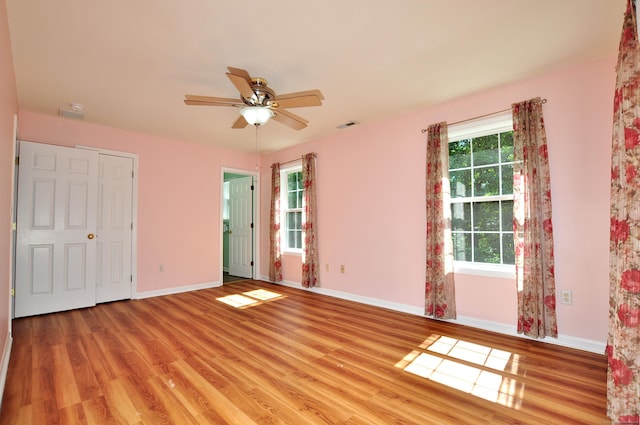 19 Windy Hill Ln Unit 19, Rocky Hill, CT 06067 - unfurnished bedroom featuring light wood-style floors and a ceiling fan