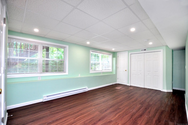 19 Windy Hill Ln Unit 19, Rocky Hill, CT 06067 - unfurnished bedroom featuring a baseboard heating unit, wood finished floors, and a paneled ceiling