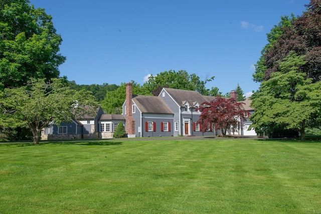 873 N Salem Rd, Ridgefield, CT 06877 - rear view of property featuring a lawn and a chimney