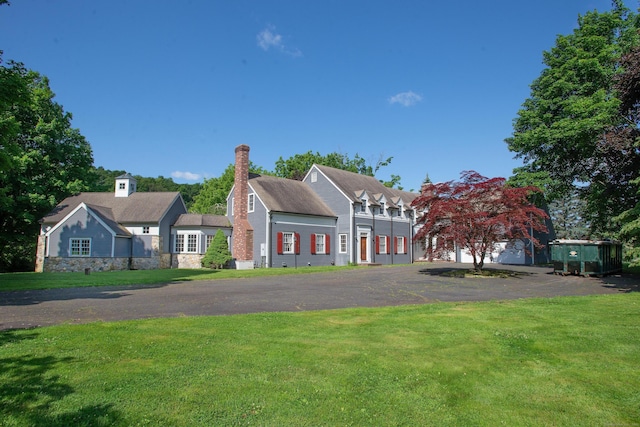 873 N Salem Rd, Ridgefield, CT 06877 - view of front facade with a front yard, a chimney, and driveway