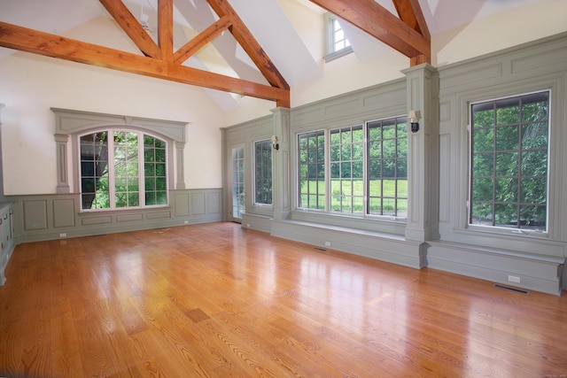 873 N Salem Rd, Ridgefield, CT 06877 - unfurnished room with a decorative wall, high vaulted ceiling, beamed ceiling, wood finished floors, and decorative columns