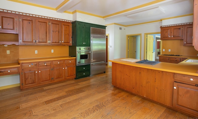 873 N Salem Rd, Ridgefield, CT 06877 - kitchen featuring stainless steel appliances, light wood-type flooring, light countertops, and ornamental molding