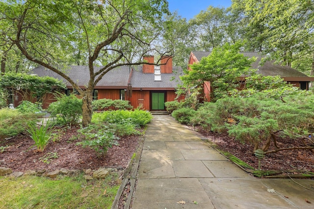 22 Blackberry Dr E, Stamford, CT 06903 - view of front facade with roof with shingles and a chimney