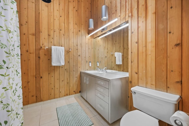 22 Blackberry Dr E, Stamford, CT 06903 - bathroom featuring vanity, wood walls, and tile patterned flooring