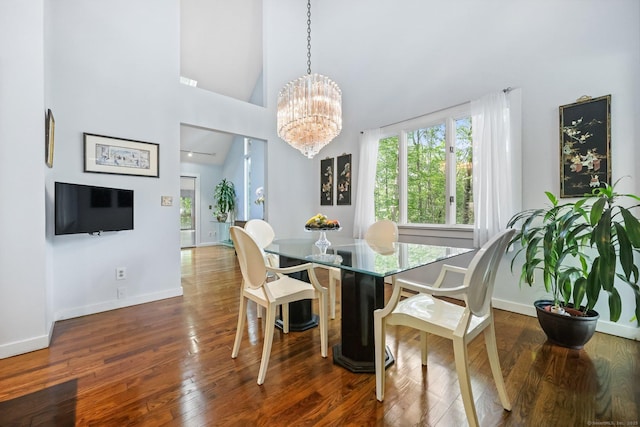 22 Blackberry Dr E, Stamford, CT 06903 - dining area featuring a chandelier, wood finished floors, and high vaulted ceiling
