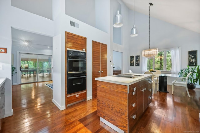 22 Blackberry Dr E, Stamford, CT 06903 - kitchen featuring high vaulted ceiling, modern cabinets, light countertops, and healthy amount of natural light