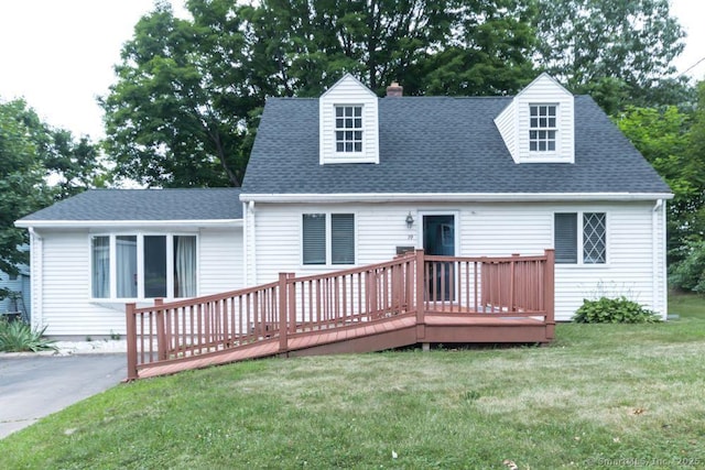 19 Garfield Rd, Bristol, CT 06010 - view of front facade with a wooden deck, a front lawn, a chimney, and roof with shingles