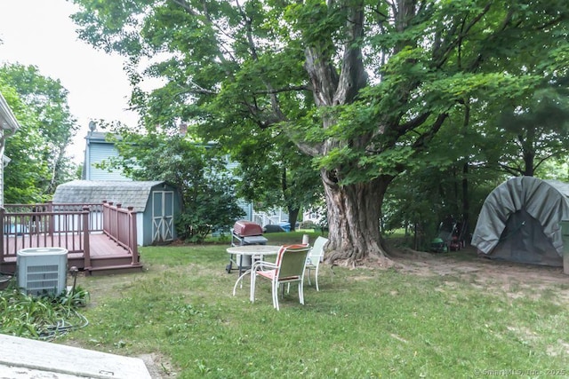 19 Garfield Rd, Bristol, CT 06010 - view of grassy yard with a storage shed and a wooden deck