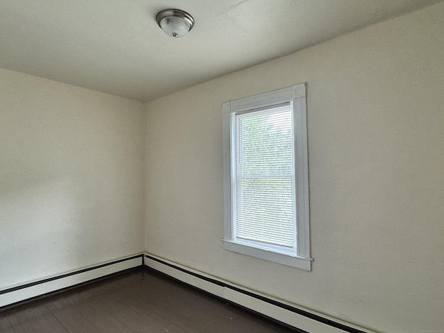 240 Washington St, New Britain, CT 06051 - spare room with dark wood-style flooring and baseboard heating