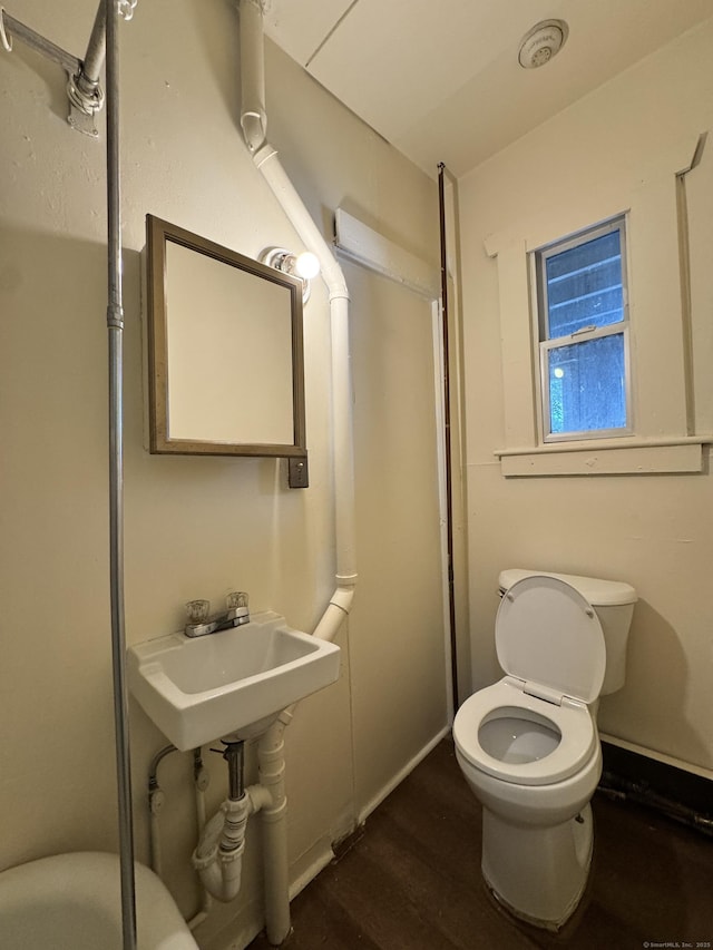 240 Washington St, New Britain, CT 06051 - bathroom with toilet and wood finished floors
