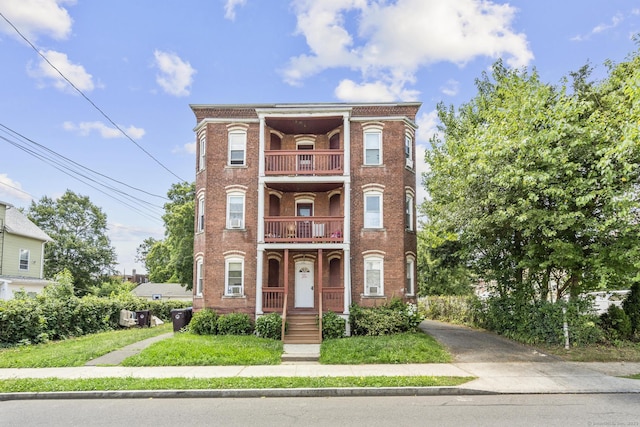 240 Washington St, New Britain, CT 06051 - view of front facade with a balcony and brick siding