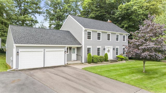 28 Fieldstone Path, Newington, CT 06111 - colonial inspired home with a garage, driveway, a front lawn, and roof with shingles
