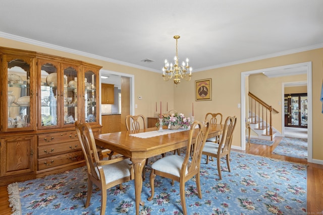 28 Fieldstone Path, Newington, CT 06111 - dining area featuring a chandelier, ornamental molding, light wood-style floors, and stairs
