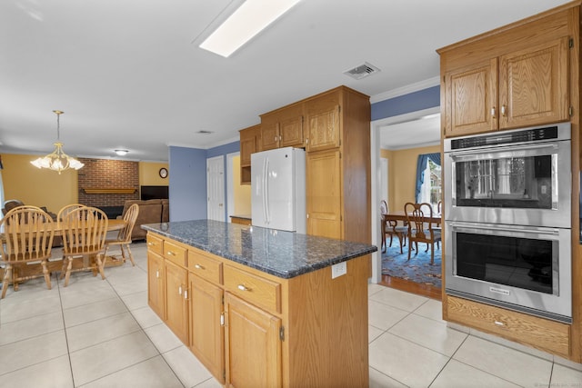 28 Fieldstone Path, Newington, CT 06111 - kitchen with double oven, freestanding refrigerator, crown molding, light tile patterned flooring, and a chandelier