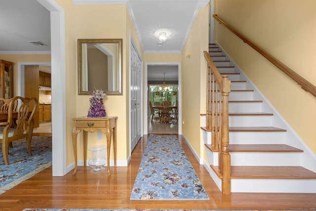 28 Fieldstone Path, Newington, CT 06111 - foyer entrance featuring stairs, ornamental molding, wood finished floors, and a chandelier