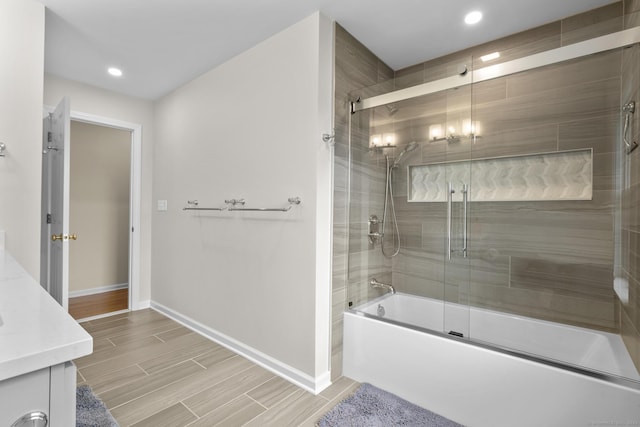28 Fieldstone Path, Newington, CT 06111 - full bathroom featuring bath / shower combo with glass door, vanity, recessed lighting, and wood finish floors