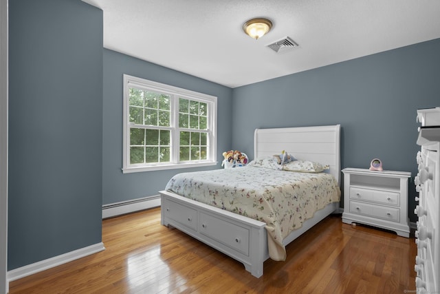 28 Fieldstone Path, Newington, CT 06111 - bedroom with a baseboard radiator and hardwood / wood-style flooring