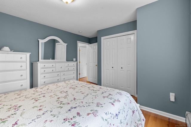 28 Fieldstone Path, Newington, CT 06111 - bedroom featuring baseboard heating, wood finished floors, and a closet