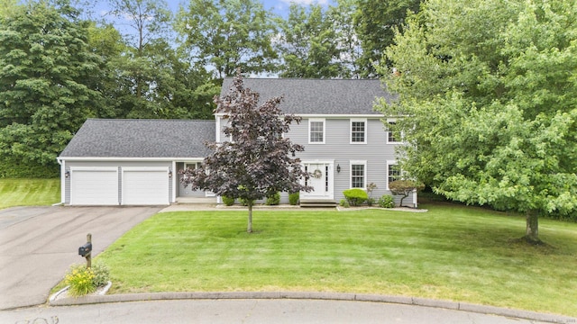 28 Fieldstone Path, Newington, CT 06111 - colonial inspired home with driveway, a garage, a front lawn, and a shingled roof