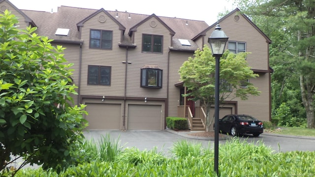 4 Rosewood Cir Unit 4, Monroe, CT 06468 - view of front of home featuring an attached garage, asphalt driveway, and a shingled roof