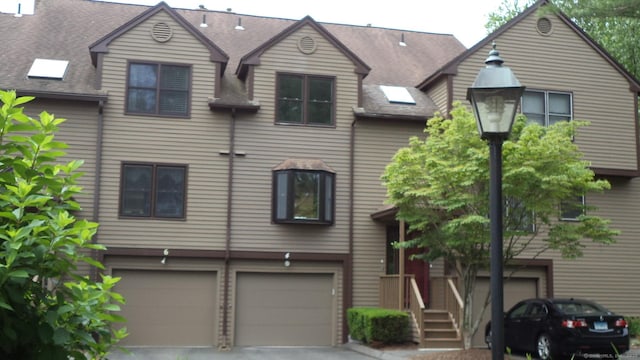 4 Rosewood Cir Unit 4, Monroe, CT 06468 - townhome / multi-family property with a garage, asphalt driveway, and a shingled roof