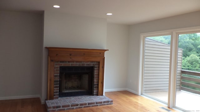 4 Rosewood Cir Unit 4, Monroe, CT 06468 - detailed view of wood finished floors, a fireplace, and recessed lighting
