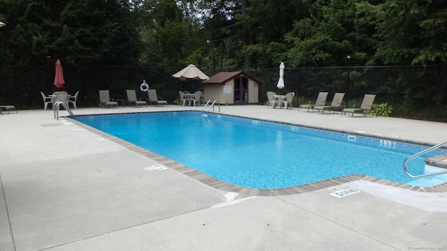 4 Rosewood Cir Unit 4, Monroe, CT 06468 - community pool with a patio and an outbuilding