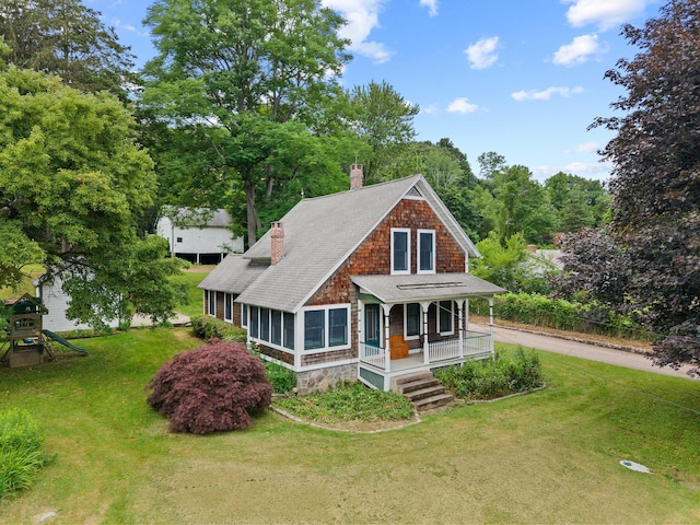 18 Cards Mill Rd, Columbia, CT 06237 - shingle-style home featuring a porch, a chimney, a front lawn, a shingled roof, and stone siding