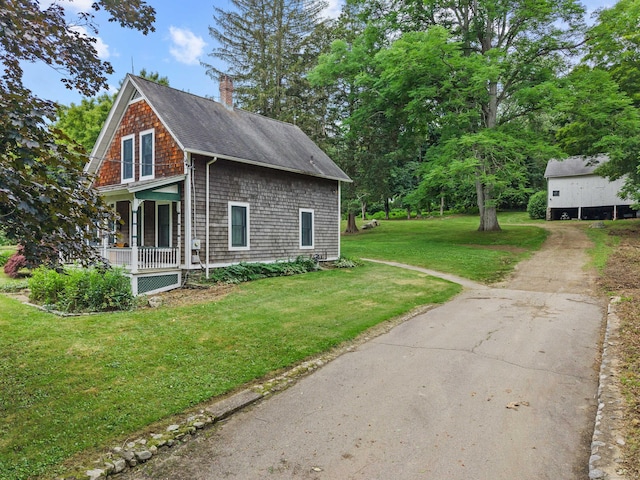 18 Cards Mill Rd, Columbia, CT 06237 - view of home's exterior with covered porch, roof with shingles, a chimney, a yard, and driveway