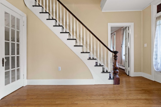 18 Cards Mill Rd, Columbia, CT 06237 - entrance foyer with wood finished floors, a baseboard heating unit, crown molding, stairway, and plenty of natural light
