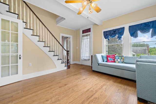 18 Cards Mill Rd, Columbia, CT 06237 - living area with wood finished floors, beamed ceiling, a ceiling fan, and stairway