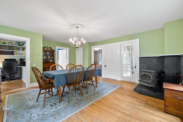 18 Cards Mill Rd, Columbia, CT 06237 - dining area featuring a chandelier, a wood stove, wood finished floors, and an office area