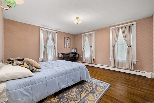 18 Cards Mill Rd, Columbia, CT 06237 - bedroom with a baseboard radiator, wood finished floors, and multiple windows