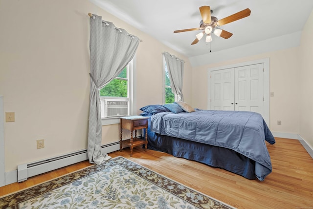 18 Cards Mill Rd, Columbia, CT 06237 - bedroom with wood finished floors, baseboard heating, ceiling fan, a closet, and cooling unit