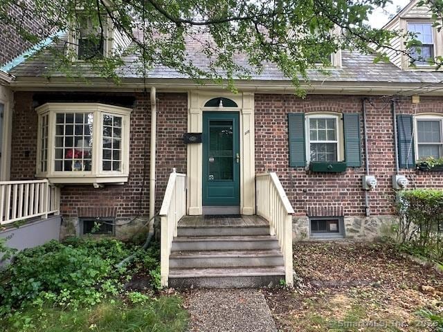 118 Sims St, Bridgeport, CT 06604 - doorway to property featuring brick siding