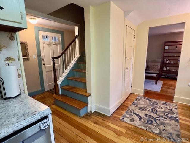 118 Sims St, Bridgeport, CT 06604 - stairs featuring wood finished floors and baseboards
