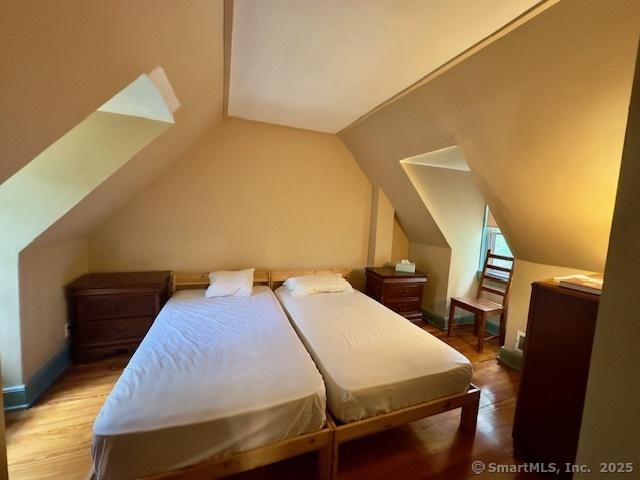 118 Sims St, Bridgeport, CT 06604 - bedroom featuring wood finished floors and vaulted ceiling