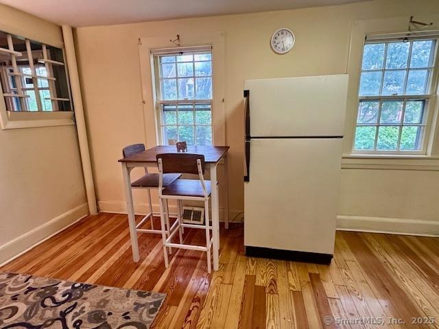 118 Sims St, Bridgeport, CT 06604 - kitchen featuring freestanding refrigerator and light wood-style floors