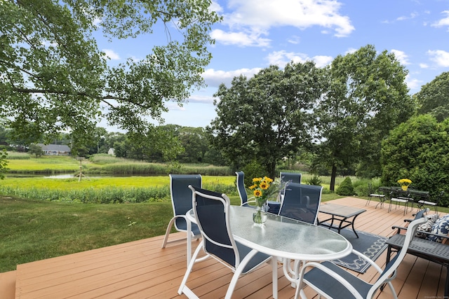 1340 Old Clinton Rd # 7, Westbrook, CT 06498 - wooden terrace featuring outdoor dining area, a water view, a yard, and view of wooded area