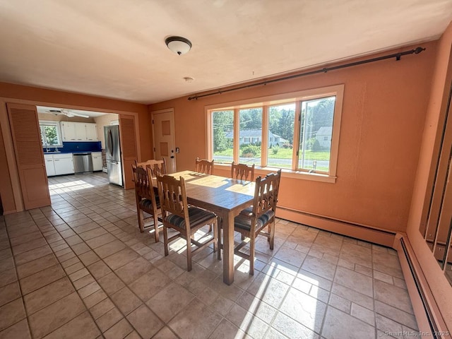 9 Meadow Brook Rd, Brookfield, CT 06804 - dining area featuring a baseboard heating unit and plenty of natural light