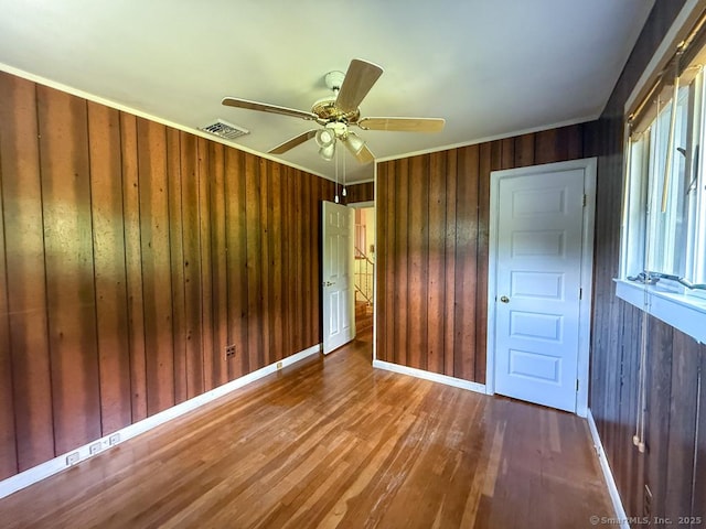 9 Meadow Brook Rd, Brookfield, CT 06804 - unfurnished bedroom with wood walls, wood finished floors, crown molding, and a ceiling fan