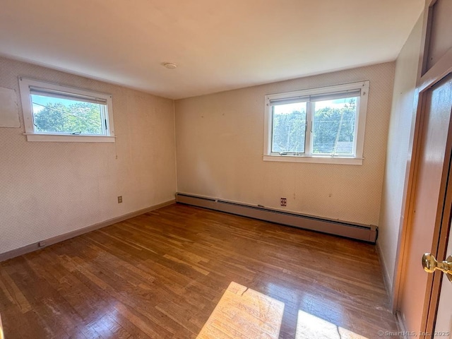 9 Meadow Brook Rd, Brookfield, CT 06804 - spare room featuring a baseboard heating unit and wood finished floors
