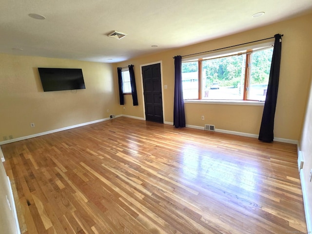 266 Cianci Rd, New Britain, CT 06053 - unfurnished living room with light wood finished floors and baseboards
