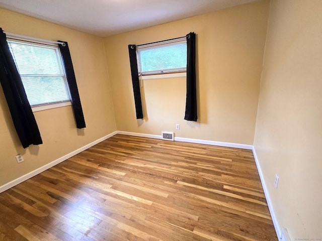 266 Cianci Rd, New Britain, CT 06053 - empty room with healthy amount of natural light and wood finished floors