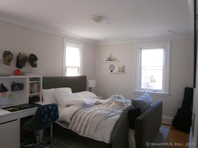 65 Sherwood Pl Unit 65, Greenwich, CT 06830 - bedroom with multiple windows, ornamental molding, a desk, and wood finished floors