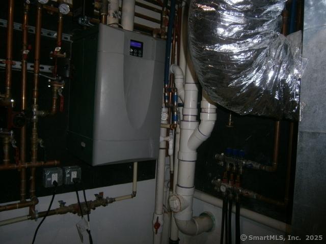 65 Sherwood Pl Unit 65, Greenwich, CT 06830 - utility room with water heater